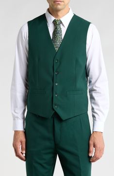 Bring understated elegance to the table in this three-piece suit crafted from rich fabric in a classic single-breasted silhouette. Jacket has notched lapels; chest welt pocket; front flap pockets Vest has front button closure; V-neck Pants have zip fly with button closure; front slant pockets; back button-welt pockets Jacket and vest are lined; trousers are lined to the knee 65% polyester, 35% viscose Dry clean Imported Each suit has a 6” drop, meaning that a size 38R jacket is paired with size Pocket Vest, Rich Fabric, Three Piece Suit, Pocket Jacket, 3 Piece Suits, Understated Elegance, Hunter Green, Three Piece, The Table