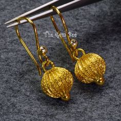 DESCRIPTION: Thank you for coming in! Spectacular 18K solid yellow gold earrings with old stock handmade high karat solid gold lantern earring pendants and rose cut diamond accents! Looks much much nicer in person! WEIGHT: 2.85 Grams DIMENSION: 1.35 Inch Total Length. MATERIAL: 18K Solid Yellow Gold, Diamond Traditional Gold Diamond Cut Earrings, Exquisite Gold Diamond Cut Earrings, 22k Gold Round Earrings Fine Jewelry, Exquisite Gold Filigree Earrings, Elegant 22k Gold Hallmarked Earrings, Exquisite Gold Earrings With Intricate Design, Yellow Gold Pendant Earrings For Festive Occasions, Traditional 14k Gold Dangle Jewelry, Traditional 14k Gold Earrings