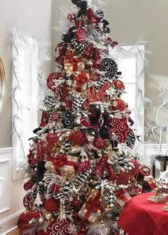 a christmas tree decorated with red and black ornaments