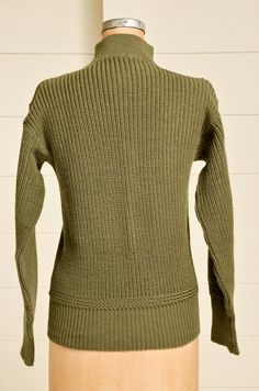 "1940s Deck Wool Sweater Army Green Knit Mock Turtleneck WWll High Neck Sweater USN deck sweater. Army green wool knit. Hand repair on front as shown. Measurements Shoulders: 18.5\" Chest: 40\" Length: 25\" Sleeve: 22\"" Vintage Sweater For Fall, Solid Vintage Sweater For Fall, Vintage Solid Sweater For Fall, Vintage Solid Color Sweater For Fall, Vintage Wool Turtleneck Sweater, Vintage Khaki Tops For Winter, Vintage Knit Sweater With Ribbed Collar, Vintage Solid Sweater With Ribbed Cuffs, Vintage Wool Sweater For Workwear