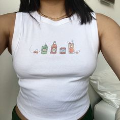 Aperol Spritz Baby Tee/Tank. Hand-drawn drink recipe for the cocktail. Check out my shop for more drinks, pop culture, and music inspired items! Shirt material is 50/50 cotton and polyester. Multicolor ink on White/Cream Clothing Each item is uniquely printed and designed by me! Available on: White Boxy Baby Tee, Estimated Women's Sizing: XS, S, M White Cropped Tank, Women's Sizing: XS, S, M, L, XL, XXL White T-Shirt, Unisex Sizing: S, M, L, XL, XXL More Sizing Available! (Made to order, Message me for XXL+ sizes) Wash instructions: Turn inside out, wash with cold water and delicate setting. Air dry preferred. Follow specific care instructions to ensure the longevity of the design for all handmade items. Check out my Instagram and Depop for customer photos and reviews. Message me with any Cream Clothing, Cream Outfits, White Crop Tank, Shirley Temple, Drink Recipe, Aperol Spritz, White Crop, Logo Tee, Logo Tees