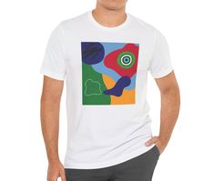 This tee features blue, red, yellow, and green abstract shapes with design elements that have been put together in an abstract collage. Stand out from the others with this bright and colorful t-shirt.  This makes a great gift for the art teacher, for the contemporary art lover, or for the art enthusiast.   This classic unisex jersey short sleeve tee fits like a well-loved favorite. Soft cotton and quality print make users fall in love with it over and over again. These t-shirts have-ribbed knit collars to bolster shaping. The shoulders are tapered for a better fit over time. Dual side seams hold the garment's shape for longer.  .: Made with 100% Airlume combed and ring-spun cotton, a lightweight fabric (4.2 oz/yd² (142 g/m that is easy to layer, breathable. Perfect for active and leisure w Multicolor Abstract Print Casual T-shirt, Casual Multicolor Abstract Print T-shirt, Artistic Cotton T-shirt With Abstract Print, Multicolor Crew Neck T-shirt With Abstract Print, Multicolor Abstract Print Crew Neck T-shirt, Artsy Multicolor Graphic Print T-shirt, Artsy Short Sleeve T-shirt With Artwork, Artistic Expression Multicolor Graphic Print T-shirt, Multicolor Screen Print T-shirt For Artistic Expression