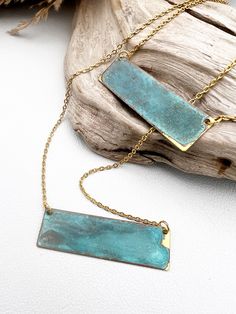 The natural turquoise of these patina necklaces are just so pretty and go with every outfit, promised. As always, we use 18 karat gold plated, stainless steel chains, which are sweat proof. The patina has been sealed for a long lasting beauty. 23” Stainless steel chains patina on brass - color and pattern will vary slightly choose your style in the drop-down box Elegant Patina Necklaces As Gift, Elegant Patina Necklaces For Gifts, Turquoise Necklace With Patina For Gifts, Handmade Rectangular Brass Necklace, Bohemian Gold Necklace With Patina, Handmade Turquoise Brass Necklace, Turquoise Necklace With Patina As A Gift, Turquoise Brass Jewelry, Bronze Tarnish Resistant Necklace For Gift