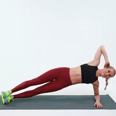 a woman is doing an exercise on a mat