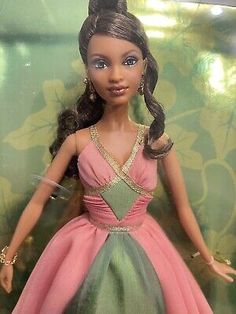 a barbie doll in a pink and green dress