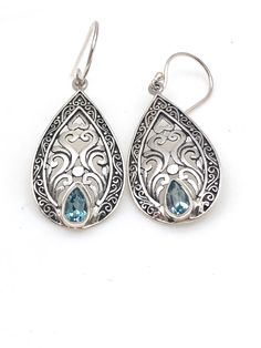 "Intricately detailed sterling silver Bali teardrop earrings with a pear-shaped semi-precious stone at the bottom measures 1 3/4\" in length from the top of the ear wire and 5/8\" in width at its widest point. The pear-shaped stone measures 1/8\" in width and 3/16\" in length. Earrings are rhodium plated over sterling silver so as to prevent tarnishing." Sterling Silver Teardrop Earrings With Intricate Design, Sterling Silver Intricate Teardrop Earrings, Sterling Silver Filigree Teardrop Earrings, Ornate Sterling Silver Teardrop Earrings, Silver Gemstone Teardrop Earrings, Ornate Teardrop Earrings As Gift, Pierced Pear-shaped Teardrop Earrings, Sterling Silver Gemstone Teardrop Earrings, Pierced Teardrop Drop Earrings In Sterling Silver