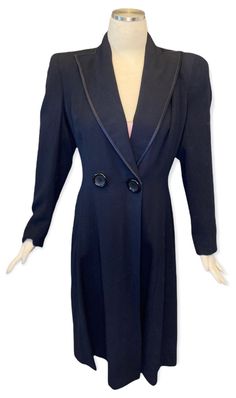 "This beautiful 1940's dress coat is so beautifully constructed creating a stunning feminine shape with the padded shoulders and tapered waistline ending with a full skirt.  Double button front closure only one functioning and one decorative.  This will be beautiful with jeans and a tee and over a cocktail dress.   Bust- 38\" Waist- 30\" Hips- 42\" Sleeve Length- 24\" Length- 43\"" Elegant Vintage Fashion Outerwear With Buttons, Elegant Fitted Outerwear For Vintage Fashion, Elegant Fitted Vintage Fashion Outerwear, Retro Fitted Formal Outerwear, Vintage Fitted Outerwear For Formal Occasions, 1940's Dress, Navy Coat, 1940s Dresses, Dress Coat