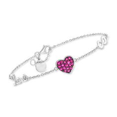 Gabriel Designs Silver Love Symbol Station Bracelet, .30ct t. w. Rubies. 6.25". From Gabriel Designs, this charming bracelet is rooted in romance! Crafted in polished sterling silver and boasting sweet symbols stationed around a dainty cable chain, including an infinity symbol, a bright heart dotted with .30 ct. t. w. round rubies in black rhodium and the word "love." Features milgrain detailing and includes a 1/2" extender. Lobster clasp, Gabriel Designs ruby and sterling silver love symbol sta Sterling Silver Clasp Jewelry For Valentine's Day Anniversary, Red Sterling Silver Anniversary Bracelet, Valentine's Day Heart Bracelet With Sterling Silver Clasp, Silver Ruby Bracelet With Adjustable Fit, Nickel-free Red Sterling Silver Bracelet, Charming Bracelet, Love Symbol, Station Bracelet, Ruby Birthstone