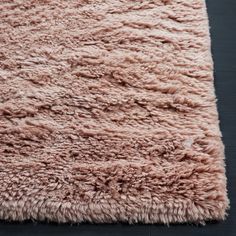 an area rug that looks like it is made out of sheep's wool and has been