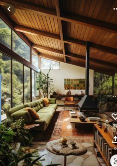 a living room filled with furniture and lots of windows