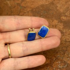 Estate/ vintage 14KT yellow gold genuine, blue lapis, rectangular shape omega back earrings. Measures: 15mm x 11.50mm Weight: 3.70 grams Omega back closure, clip on, but for $30 would connect a post. These were once pierced, but have been converted to clip. Stamped 14K/585 Charms not included Excellent estate condition 14k Gold Oblong Earrings For Gift, 14k Gold Oblong Earrings As Gift, Rectangular Lapis Lazuli Jewelry As Gift, Blue Rectangular Gemstone Earrings, Rectangular Blue Earrings For Anniversary, Pearl Accessories, White Gold Bracelet, Rose Gold Pendant, Back Jewelry