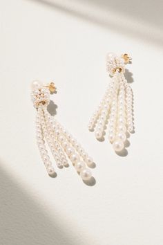 Sophie Bille Brahe works with pearls in beautifully unexpected ways. These 'Colonna Grande' earrings are crafted from 14-karat recycled gold and strung with strands of lustrous freshwater pearls that graduate in size. They're a chic way to elevate simple knitwear. White 14k Gold Jewelry For Evening, Refined 14k Gold Wedding Earrings, Evening 14k Gold Pearl Drop Jewelry, Evening 14k Gold Jewelry With Pearl Drop, 14k Gold Pearl Drop Jewelry For Evening, Fine Jewelry Akoya Pearl Earrings For Evening, White Akoya Pearl Jewelry For Evening, Evening 14k Gold Pearl Drop Earrings, Fine Jewelry Pearl Earrings With Pearl Chain