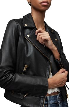 Smooth, rich leather secures the style-staple status of this biker jacket in a classic silhouette with all the timeless moto details. Asymmetric zip closure Notched lapels Zip cuffs Front zip pockets Lined Leather Professional leather clean Imported Fitted Luxury Leather Jacket By Allsaints, Allsaints Biker Leather Jacket, Allsaints Leather Biker Jacket, Allsaints Women's Biker Outerwear, Allsaints Leather Biker Jacket With Zipper Closure, Leather Biker Jacket, Leather Cleaning, All Saints, Biker Jacket