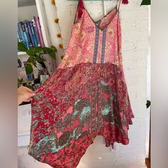 Beautiful Dress In Mint Condition, New With Tags, Never Used! Got It At A Local Boutique. Loose Flowy Fit. Adjustable Tie Straps. Bold Ornate Color And Design With Gold Details. Perfect For Summer Or Layering With Boots And Undershirts Year Round. Pink Paisley Print Beach Dress, Flowy Beach Dress With Floral Patchwork, Flowy Floral Patchwork Beach Dress, Bohemian Festival Dresses With Handkerchief Hem, Bohemian Dress With Handkerchief Hem For Festivals, Bohemian Midi Dress With Floral Patchwork, Bohemian Patterned Dress With Floral Patchwork, Summer Silk Patchwork Dress, Summer Silk Dress With Paisley Print