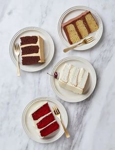 three slices of red velvet cake on plates