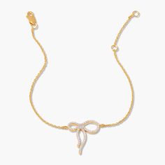 Add some sparkle to your wrist with the Adeline Bow Vermeil Bracelet. This gold vermeil bracelet has delicate pave bow and is the perfect mix of elegance and playfulness. A must-have accessory for any occasion! Available in 14k gold vermeil Size: 17mm x 15mm bow 1mm white topaz 6"-7" cable chain Lobster claw closure SKU: BYB1276 Chic Yellow Gold Diamond Bracelet As Gift, Chic Yellow Gold Diamond Bracelet Gift, Elegant Yellow Gold Diamond Bracelet For Party, Tennis Jewelry, Amethyst Bracelet, Monogram Initials, White Topaz, Gemstone Bracelet, Turquoise Jewelry