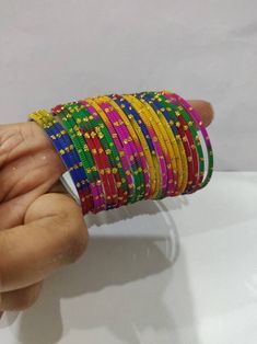 Welcome to our shop We bring to you very ethnic products from core of India almost every thing is handmade or custom made Set of 22 Bangles in multiple colors Size 2.4 We will be happy to serve you Pink Handmade Traditional Bangle, Traditional Adjustable Multicolor Bangle, Multicolor Bangle With Colorful Beads For Festival, Multicolor Beaded Bangle For Festival, Adjustable Multicolor Bangle With Round Beads, Adjustable Multicolor Bangle, Adjustable Multicolor Bangle With Colorful Beads, Adjustable Multicolor Beaded Bangle, Multicolor Beaded Bangle