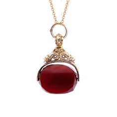 Elevate your style with our extraordinary 10K yellow gold Spinning Carnelian Watch Fab Pendant. This exquisite pendant showcases a beautiful carnelian stone that spins within an intricate gold holder. The captivating carvings on the gold holder add a touch of sophistication and artistry.  Selling Price: $ 1400.00 Diamond Heels, Amethyst And Diamond Ring, Buddha Pendant, Carnelian Stone, Aquamarine Gemstone, Fun Earrings, Opal Jewelry, 10k Gold, Gold Style