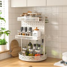 a kitchen with white tiled walls and wooden flooring, shelves filled with various items