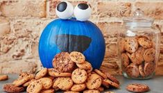 a pumpkin decorated with googly eyes and cookies