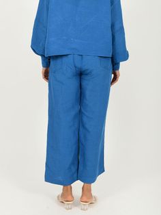 VALUES Handcrafted Organic Traditional CURATOR'S NOTE Experience effortless comfort and relaxed sophistication with our Classic Blue Linen Pants. Crafted with a linen blend in an indigo hue, these pants feature two side pockets for perfect practicality, all while providing you with a high-end modern look. Perfect for any occasion, these beautiful pants are the perfect accompaniment to your wardrobe. THE DESIGNER STORY A young clothing brand based in Jaipur, Rias is more than just a label. Focusi Indigo Wide Leg Bottoms With Relaxed Fit, Indigo Wide Leg Bottoms With Pockets, Relaxed Fit Indigo Wide Leg Pants, Relaxed Fit Wide Leg Indigo Pants, Indigo Wide-leg Pants With Pockets, Indigo Relaxed Fit Wide-leg Pants, Blue Linen Wide-leg Pants, Indigo Relaxed Fit Straight Leg Pants, Indigo Straight Leg Bottoms With Pockets