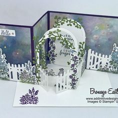 two cards with white pickets and purple flowers on them, one has a gate