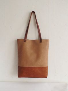 Large vegan leather tote - color block vegan leather tote bag in cognac brown and caramel/toffee brown. * Exterior: - Bottom - high quality vegan leather in cognac brown color -Top - high quality very durable vegan leather in sandy\caramel\toffee brown color * Interior: - Available with natural cotton polka dot lining in sandy beige and white or natural linen geometric print pattern in light beige. Please choose the lining you prefer from Variations. * Two inside slip pockets * Real leather hand Rectangular Caramel Bag With Leather Handles, Brown Satchel With Leather Handles For Everyday, Caramel Rectangular Bags With Leather Handles, Everyday Caramel Satchel Shoulder Bag, Rectangular Caramel Bags With Leather Handles, Caramel Tote Shoulder Bag, Beige Leather-backed Tote Bag, Beige Leather-backed Tote Satchel, Dark Tan Leather Handled Tote Satchel