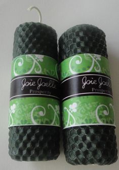 two rolls of black and green colored yarn