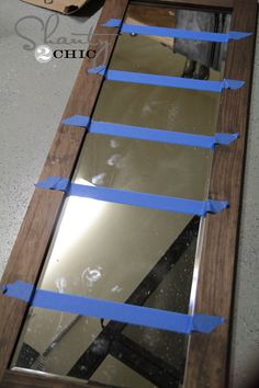 a mirror with tape taped around the edges