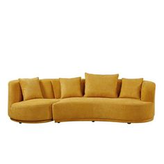 a large yellow couch with pillows on the bottom and back ends, sitting in front of a white background