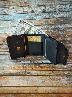 "A compact trifold wallet \"Mini\" that is loaded with function, practicality, storage and it is perfect for carrying multi-cards and cash. The wallet is made from genuine Crazy Horse leather, which gives vintage appearance to products. It means that a brand new wallet scuffs very easily and will look like it is yours for ages. You can \"repair\" scuffs easily with a cotton soft cloth or your fingers - you just need wipe it softly. The wallet is sewed by durable waxed thread of 0,55 mm thick by hands. It is an amazing and useful gift for any occasion: Birthday, Anniversary, Christmas, Valentine's Day, Graduation, Corporate Gift or any other occasion, or simply as an upgrade to your old wallet.   This is purely handmade Can be personalized. Outside material: stable real leather Crazy Horse. Black Trifold Wallet With Coin Pocket For Daily Use, Black Trifold Wallet With Coin Pocket For Everyday, Black Trifold Card Holder With Coin Pocket, Trifold Wallets With Coin Pocket For Daily Use, Black Trifold Wallet With Coin Pocket, Black Trifold Wallet With Card Slots For Everyday, Black Trifold Wallet For Daily Use, Black Trifold Wallet For Everyday Use, Black Trifold Card Holder For Daily Use