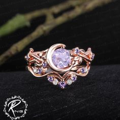 Unique lavender amethyst engagement ring sets Art deco rose gold promise ring Nature inspired moon leaf bridal sets Handmade jewelry gifts ring information: <-> Center stone: 6 mm round cut lavender amethyst <-> Side stone: 0.04ctw amethyst <-> - Band Thickness: 1.3 mm, Band Width: 2.5 mm Band information: <-> stone: 0.178ctw Amethyst + Moissanite <-> - Band Thickness: 1.2 mm, Band Width: 1.4 mm Metal: 925 silver, 10K 14K or 18k solid white gold, yellow gold, rose gold (please use the drop down Two Part Engagement Ring, Purple And Gold Engagement Ring, Purple Wedding Rings Set, Lavender Amethyst Engagement Ring, Fairy Core Rings, Amethyst Diamond Ring, Fairycore Engagement Ring, Pretty Engagement Rings Unique, Beautiful Rings Unique