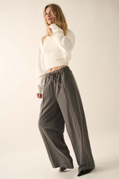 Solid twill pants. Drawstring elastic waist. Hip pockets. Wide leg. Pintuck detail. Full length. Loose fit. 70% Tencel, 25% Rayon, 5% Spandex. Imported. Designed in LA. Model wears size S. Fall Ankle-length Sweatpants With Drawstring, Relaxed Fit Fall Pants With Elastic Side Panels, Relaxed Fit Pants With Elastic Side Panels For Fall, Fall Pants With Elastic Side Panels And Relaxed Fit, Fall Tapered Leg Pants With Elastic Cuffs, Fall Straight Sweatpants With Elastic Waistband, Fall Straight Pants With Elastic Cuffs, Stretch Straight Leg Pants With Drawstring, Fall High-waisted Pants With Elastic Cuffs