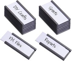 four stacks of business cards with words written on them