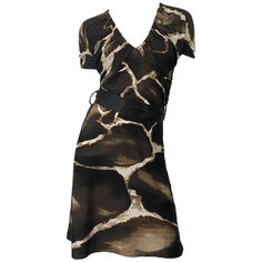 Chic and rare vintage mid / late 80s ROBERTO CAVALLI for NEIMAN MARCUS giraffe print belted short sleeve jersey dress! Features timeless giraffe animal print in chocolate brown and ivory. Flattering ruched tailored bodice and sleeves. Hidden zipper up the side. Detachable brown silk belt. Can easily be dressed up or down. Great with wedges, flats or sandals for day, and heels or boots for evening. In great condition. Made in Italy Marked Size IT 42 ( US 6 / 8 ) Measurements: (lots of stretch) 34 90s Jersey, Grey Silk Dress, Giraffe Dress, Roberto Dress, Informal Dress, Classy Fits, Late 80s, Printed Gowns, Black Dress With Sleeves