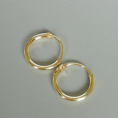 12mm sterling silver endless ear hoops, dipped in gold. Size: 1.5 x 12 mm These earrings are made of real 925 hypoallergenic sterling silver, dipped in real gold. Will be packaged in a gift box. Please let me know if you don't want it in one. I can write out a message from you to the receiver if needed. Please be free to contact me at... bhavnakwintra1956@gmail.com More hoops: https://www.etsy.com/your/shops/TheSilverGame/tools/listings/section:26305414 More earrings: https://www.etsy.com/your/s Nickel-free Minimalist Huggie Septum Ring, Adjustable Small Hoop Septum Ring For Everyday, Minimalist Nickel-free Hoop Septum Ring, Nickel Free Minimalist Hoop Septum Ring, Nickel Free Hoop Septum Ring For Everyday Wear, Nickel-free Hoop Septum Ring For Everyday, Nickel-free Hoop Septum Ring, Adjustable Hoop Nose Rings For Everyday, Everyday Hypoallergenic Small Hoop Septum Ring