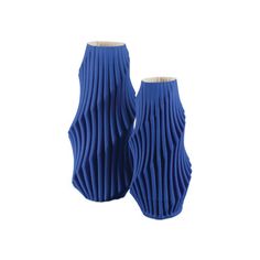 two blue vases sitting next to each other on a white background, one is made out of pleated material