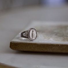 Do you wear Our Lady's Miraculous Medal?⁠ ⁠ Totally unique in its design, this stunning Miraculous Medal ring will no doubt create attention on the hand of its wearer. ⁠#catholic #jewelry #catholicwomen Catholic Women, Catholic Jewelry, Holy Mary, Miraculous Medal, No Doubt, The Hand, Catholic Faith, Crystal Gems, Rings For Men