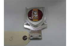 a badge with a horse on it and a price tag