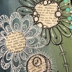 an altered book page with flowers and words on it