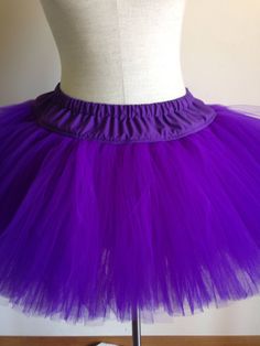 "This adult size tutu features your choice of tulle in colors of red, purple, blue, green, yellow,white black or orange sewn onto a fabric waistband. Tulle is aprox 11 inches in length. Waistband is 3 inches in length. Elastic fits waists size 27\" - 39\". Also available in plus sizes. Check out the TuTu section of my shop for my complete line of adult sized TuTus, headband tutus and pet tutus." Tutu Pink, Green Tutu, Purple Tutu, Red Riding Hood Costume, Red Tutu, Ugly Sweater Party, Pink Tutu, Bright Purple, Knot Headband