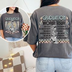 Get ready to rock your graduation with our Graduation World Tour Shirt! Featuring a retro concert tee design, the front boasts "Graduation, World Tour" alongside a guitar, angel wings, and lightning bolts, while the back lists positive attributes like Success, Opportunity, Dedication, and Wisdom. With the ever-popular checkered pattern, a rose vine climbing the guitar handle, and a graduation cap atop, this shirt is as stylish as it is symbolic. Perfect for wearing all year round, whether it's t Graphic Tee Tops With Graphic Print For Graduation, Guitar Angel, Positive Attributes, World Tour Shirt, Rose Vine, High School Graduation Party, Lightning Bolts, Graduation Shirts, Class Of 2024