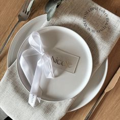 a table setting with place settings and napkins