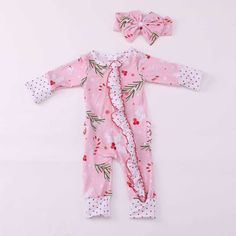 This is an adorable  footies romper made from soft bamboo fabric.  This type fabric is the new and comfy feel for newborns. This is a light weight fabric but super soft for babies Listing includes * footies  * headband is sold separately due to limited fabric supply * double zipper (this is an amazing feature you will love when changing) Romper has cuffs that fold over the hands and feet Super cute for Santa pictures Pink Cotton Onesie For Pajama Party, Pink Cotton Christmas Sleepwear, Cute Pink Sleepwear For Holiday, Playful Pink Long Sleeve Jumpsuits And Rompers, Playful Long Sleeve Pink Jumpsuits And Rompers, Pink Onesie For Winter Pajama Party, Playful Pink Onesie As A Gift, Playful Pink Onesie As Gift, Cute Christmas Onesie