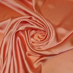 a close up view of an orange satin fabric