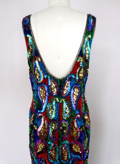 "This fun vintage party dress is fully embellished with colorful sequins and in perfect condition! Measurements: Bust - 36\" Waist - 30\" Hips - 38\" Length - 37\" Tag Size - Medium This dress comes from a pet-free and smoke-free home. If you would like more info or have any questions, please don't hesitate to ask!" Embellished Multicolor Sequin Dress For Night Out, Multicolor Embellished Sequin Dress For Night Out, Fitted Sleeveless Sequin Dress For Festivals, Glamorous Multicolor Festive Dress, Glamorous Party Dress For Festivals, Glamorous Festival Party Dresses, Festival Fitted Sequin Dresses, Multicolor Festival Dress For Party Season, Fitted Sequin Festival Dresses