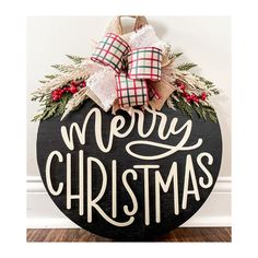 a merry christmas sign hanging on the wall