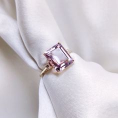 This stunning ring is set in 14k Solid Yellow Gold with Natural Pink Amethyst & Diamond with utmost precision. It is an unique statement gemstone ring for nearly every occasion and is completely hassle-free jewelry. ITEM DETAILS * Center Gem: Pink Amethyst  * Gem Size: 8X10mm * Gem Shape: Octagon (Emerald Cut) * Gem Weight: 3.14 carats * Side Gem: Diamond * Gem Size: 2mm (2pc) * Gem Shape: Round Cut * Gem Weight: 0.058 carats * Total Gem Weight: 3.20 carats * Gold Purity: 14KT * Gold Weight: 1.4 Luxury Rectangular Amethyst Engagement Ring, Luxury Vs Clarity Amethyst Engagement Ring, Luxury Yellow Gold Amethyst Ring With Emerald Cut, Exquisite Yellow Gold Amethyst Ring With Accent Stones, Amethyst Ring In Yellow Gold With Diamond Accents, Elegant Amethyst Diamond Ring With Gemstone Accents, Yellow Gold Amethyst Ring With Diamond Accents, 14k Gold Purple Ring With Diamond Accents, Fine Jewelry Yellow Gold Amethyst Diamond Ring