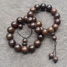 Description :  Size : 16 MM average Contain : 14 beads per strand Weight : about 30 grams Origin : Java - Indonesia These beads are handmade from genuine Indonesia Rosewood (Dalbergia Latifolia). Generally known as Sonokeling Wood in Indonesia. It has a charming dark brown color and comes with a crown on each bracelet. Some beads maybe not perfectly round and a little different size So beautiful and makes a Great gift! You will receive similiar item as shown in the picture  (Due to the difference settings between monitor and the lighting, the pictures may not reflect the exact color of the item). So please read the items description carefully before place a bid. Natural Wooden Beads Spiritual Bracelet, Handmade Wooden Beaded Bracelets For Meditation, Traditional Wooden Bracelet With Round Beads, Traditional Wooden Bracelets With Round Beads, Traditional Wood Bracelets With Round Beads, Artisan Brown Beaded Bracelet With Wooden Beads, Artisan Brown Beaded Bracelets With Wooden Beads, Artisan Brown Wooden Beads Bracelet, Artisan Brown Wooden Beaded Bracelets