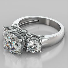 two engagement rings with diamonds on them